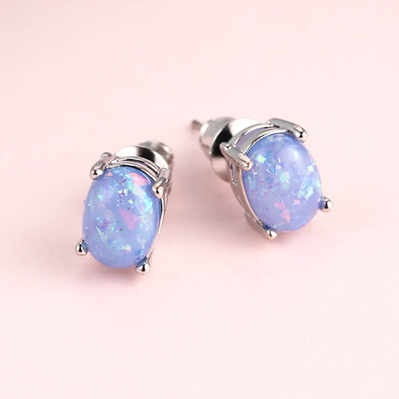 Blue Simulated Fire Opal Oval Solitaire On 14K White Gold Plated Stud Earrings