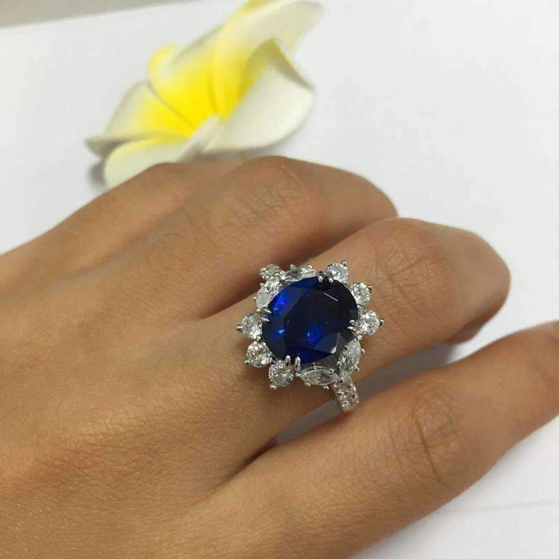 Coralie En Bleu 4CT Oval Floral Halo IOBI Simulated Diamond Ring