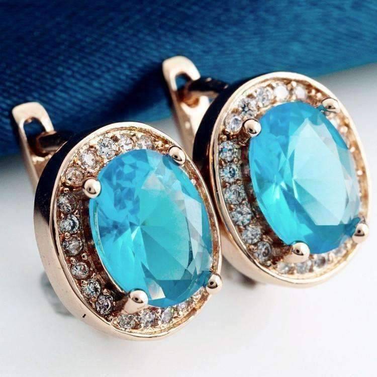 Feshionn IOBI Earrings Blue Topaz on Rose Gold Oval Solitaire Halo Earrings in Sapphire, Emerald, Topaz or White CZ