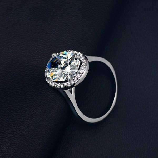 Feshionn IOBI Rings ON SALE - "Celebrity" 6 Carat Oval Engagement Ring in White Gold Plated Halo Setting Ring